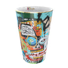 Luxury home fragrance candles, inspired by Parra’s bold urban art, reflecting themes of capitalism and social awareness.