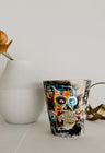 Artistic scented candles, capturing Parra's perspective on capitalism, urban decay, and the exploitation in Latin American culture.